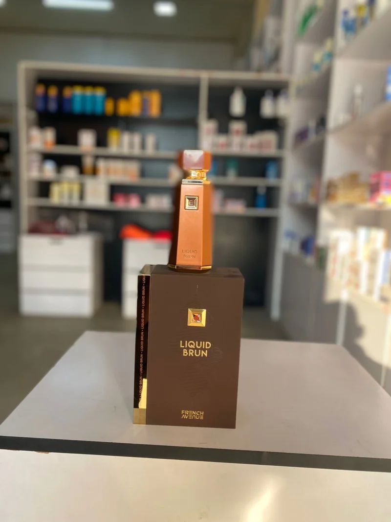Tall copper-toned bottle with a brown Liquid Brun box — French Avenue Liquid Brun