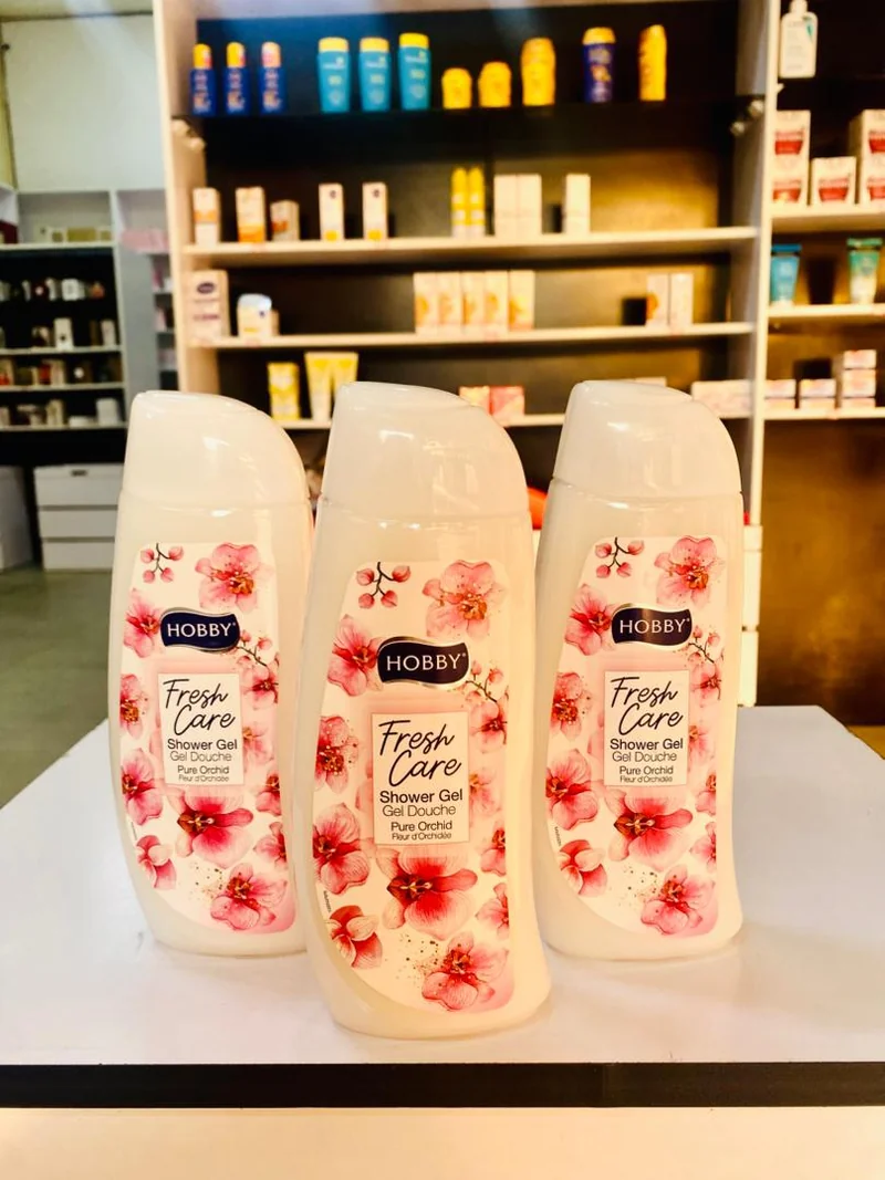 Three matching HOBBY Fresh Care Pure Orchid shower gel bottles