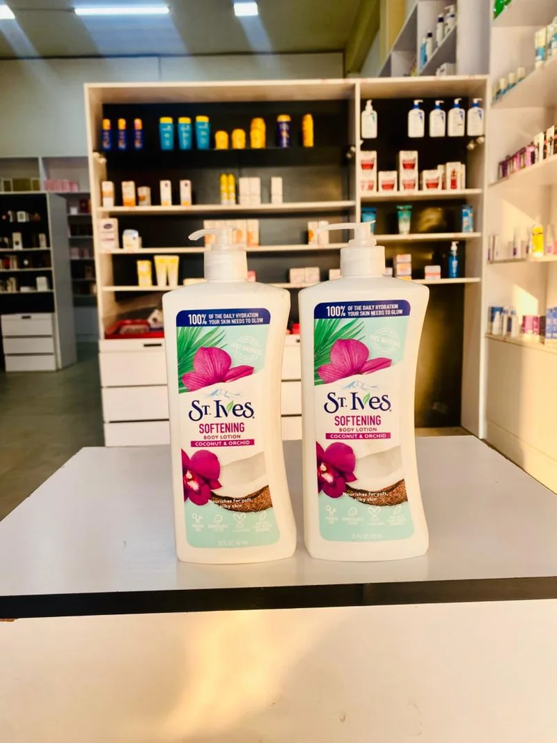 Two St. Ives coconut and orchid body lotion pump bottles