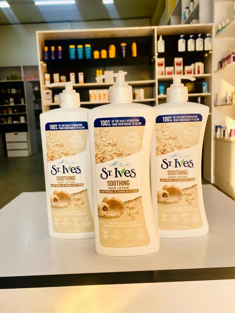 Three St. Ives oatmeal and shea butter body lotion pump bottles